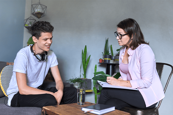 Teenage boy talking to a lawyer