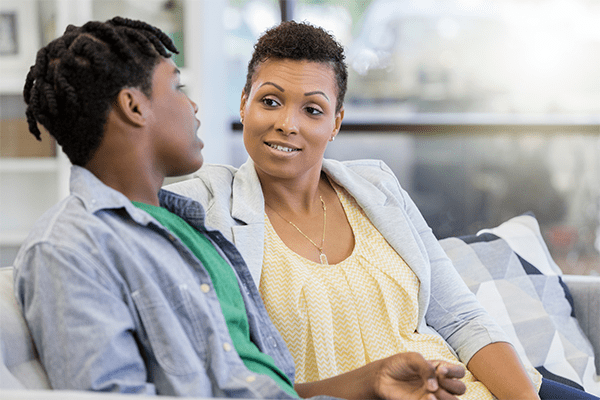 Teenage son talking to mother