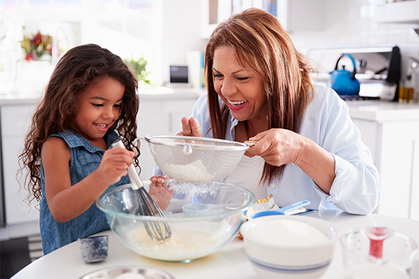 grandmother and granddaughter baking