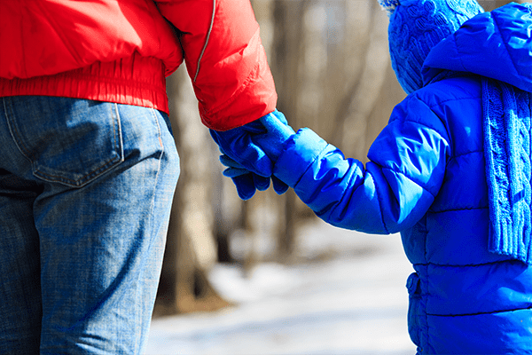 Mother and son holding hands