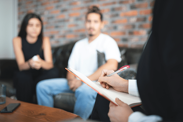 Couple talking to lawyer