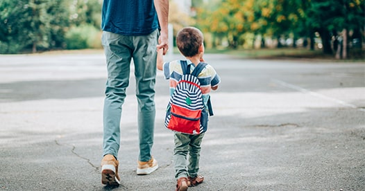 Father walking child to school