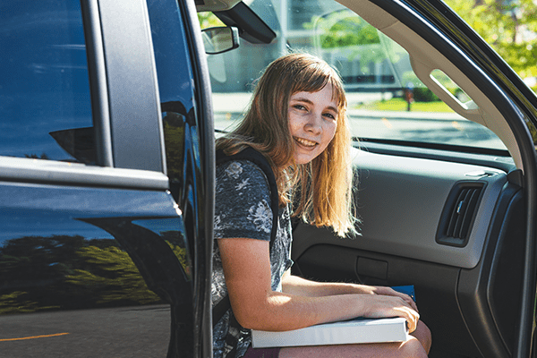 Teenage daughter in car