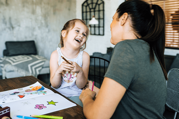 Mother coloring with her daughter