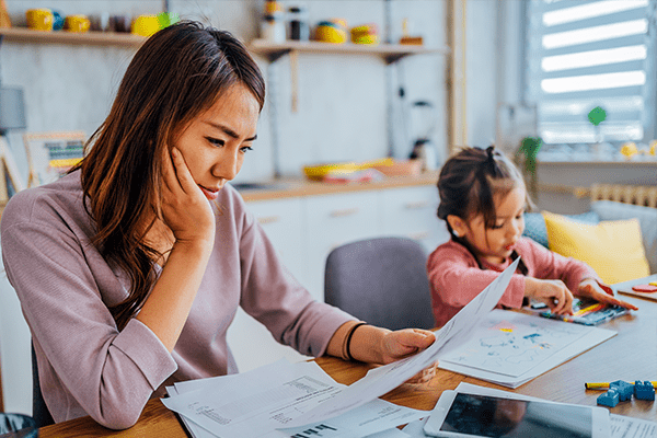 Mother looking at bills