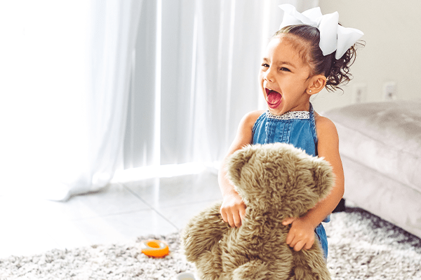 Crying child with teddy bear