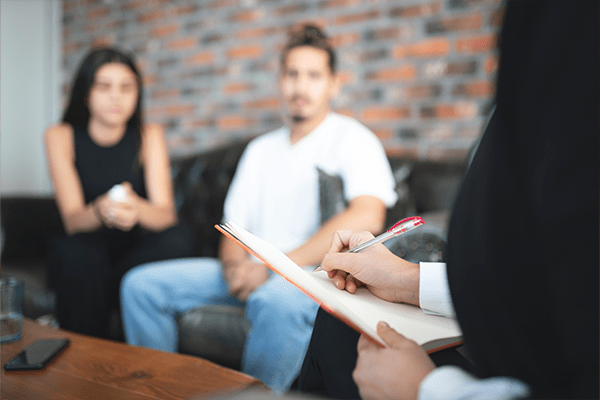 Couple talking to lawyer