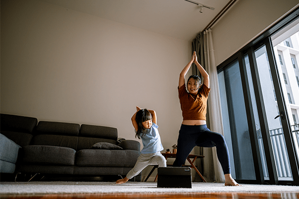 Mother and toddler doing yoga