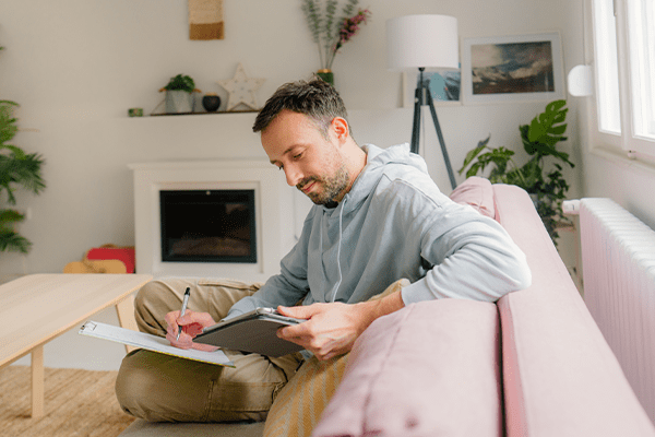 Man writing in a planner