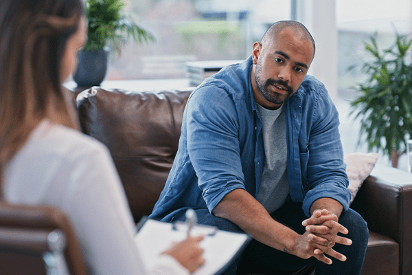 Man speaking to a therapist