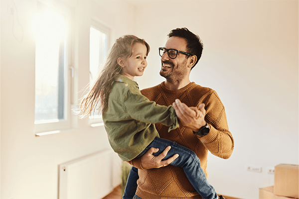 Father holding daughter