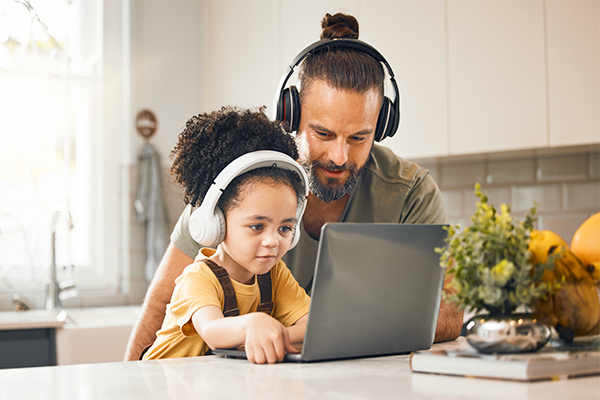 Father and daughter listening to music