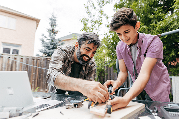 Father teaching son carpentery