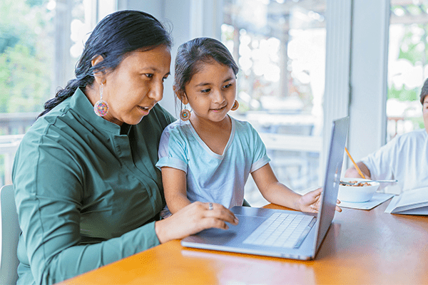 Mother and daughter on computer