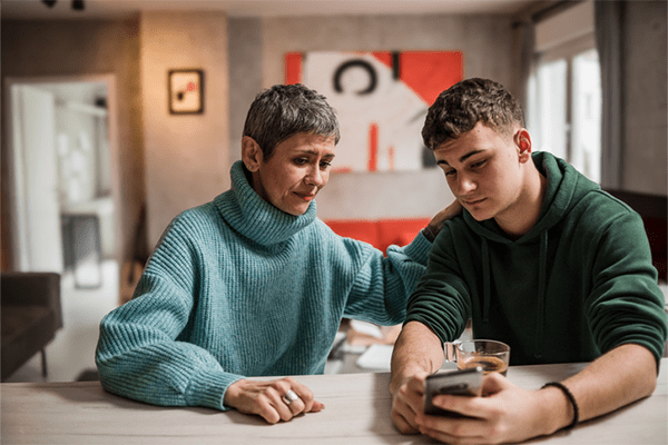 Mother talking to teenage son