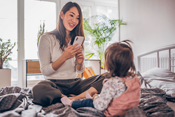 Mother taking picture of child