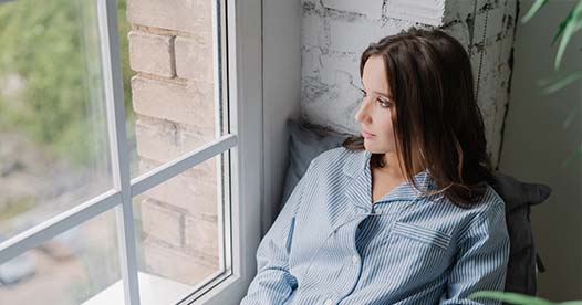 Woman looking out a window