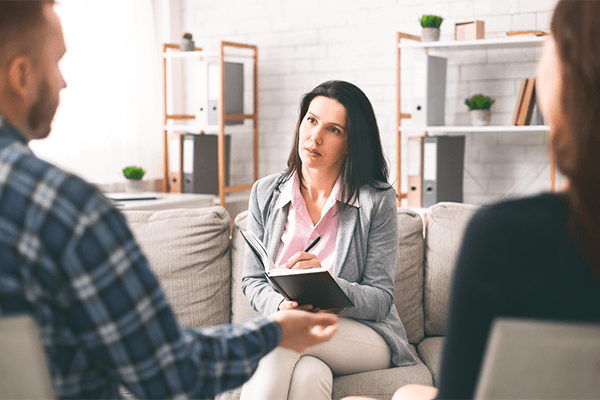 Co-parents talking to mediator